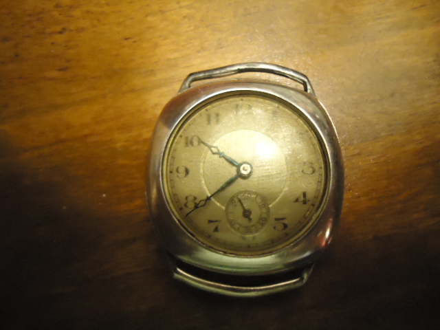 silver cased watch
